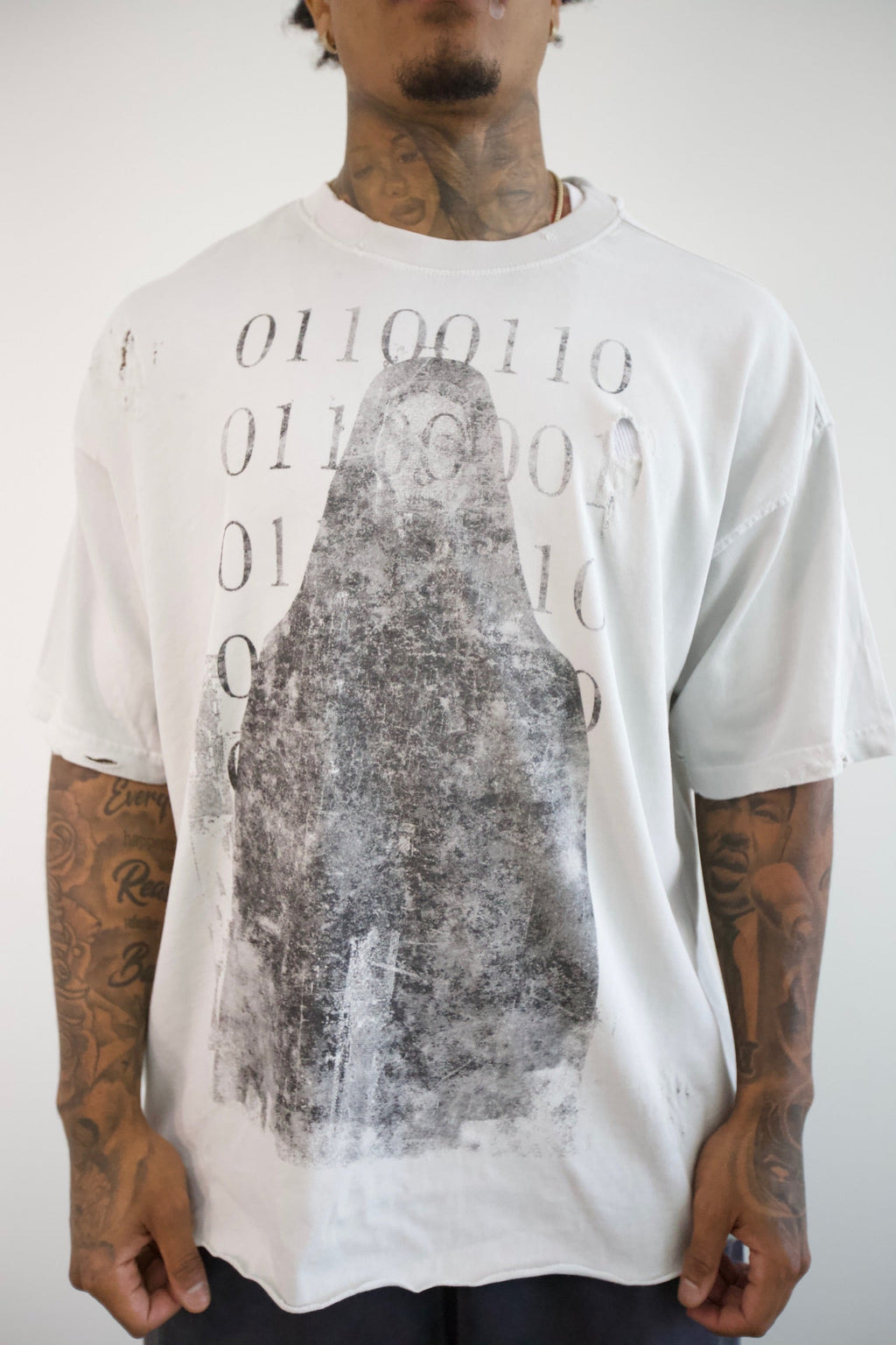 Binary Code Oversized Tee — three-quarter front on model