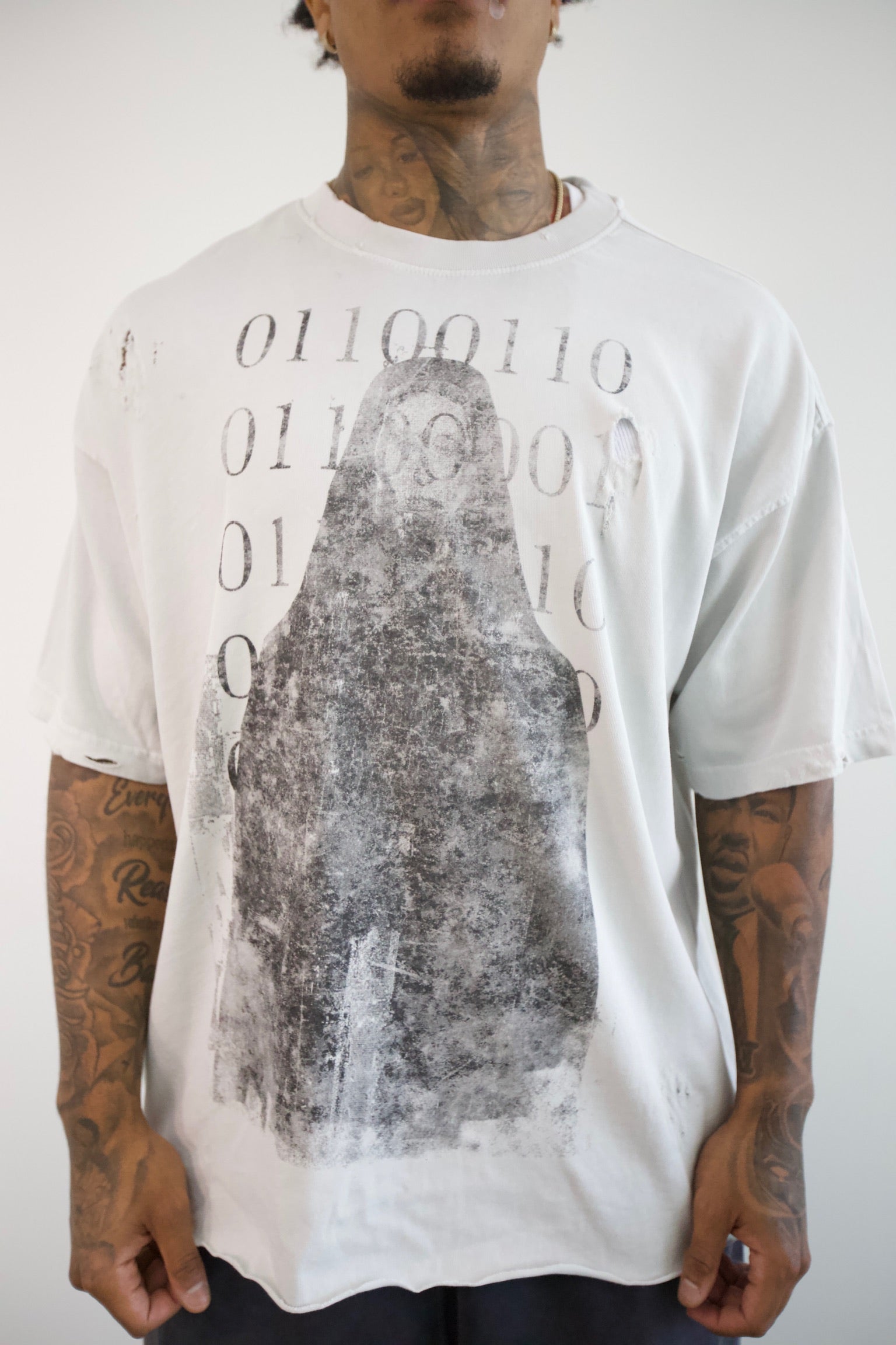 Binary Code Oversized Tee — three-quarter front on model